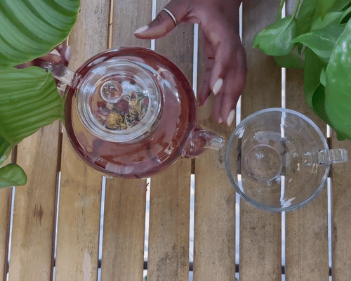 Tea pouring from Kettle to Tea Cup