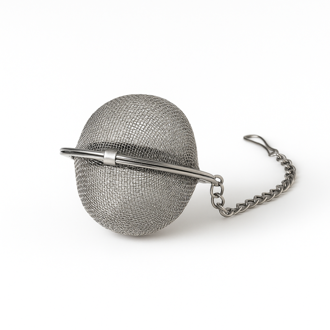 Metallic tea ball with chain on a white background