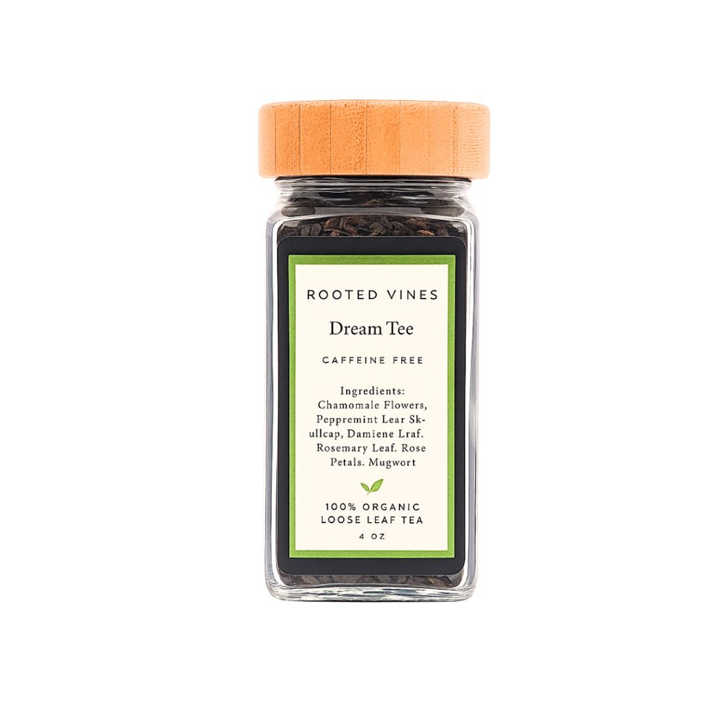 Glass jar of Rooted Vines Dream Tea with a wooden lid on a white background