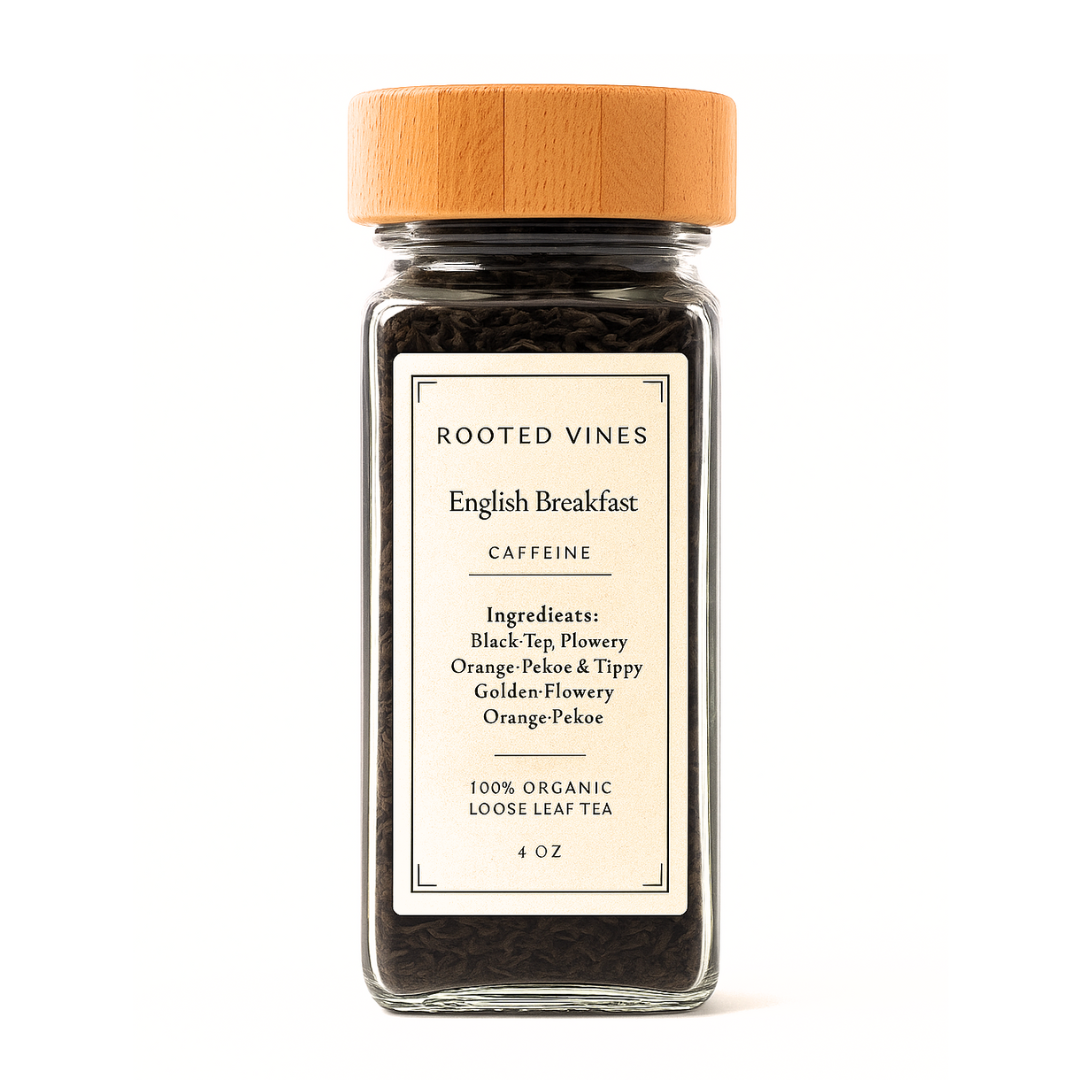 Glass jar of 'English Breakfast' loose tea with a wooden lid on a white background, featuring 'Rooted Vines' branding.