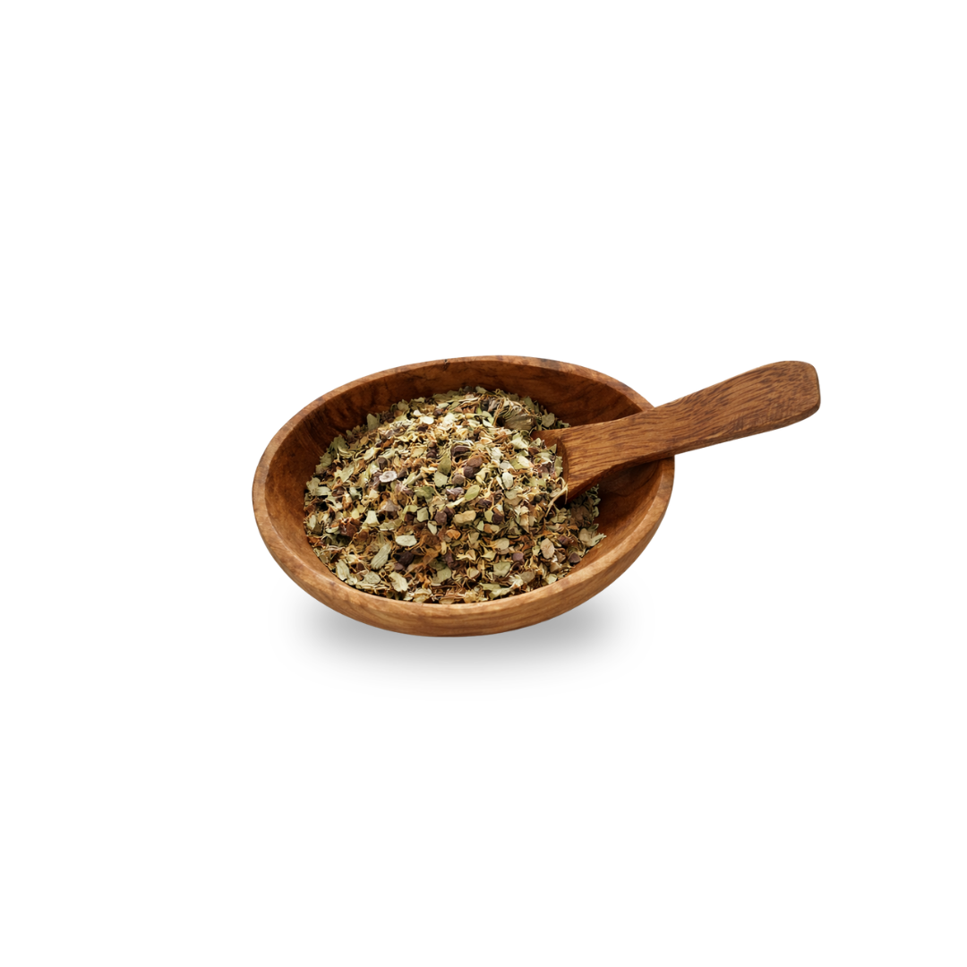 Wooden bowl with a wooden spoon containing dried herbs on a white background