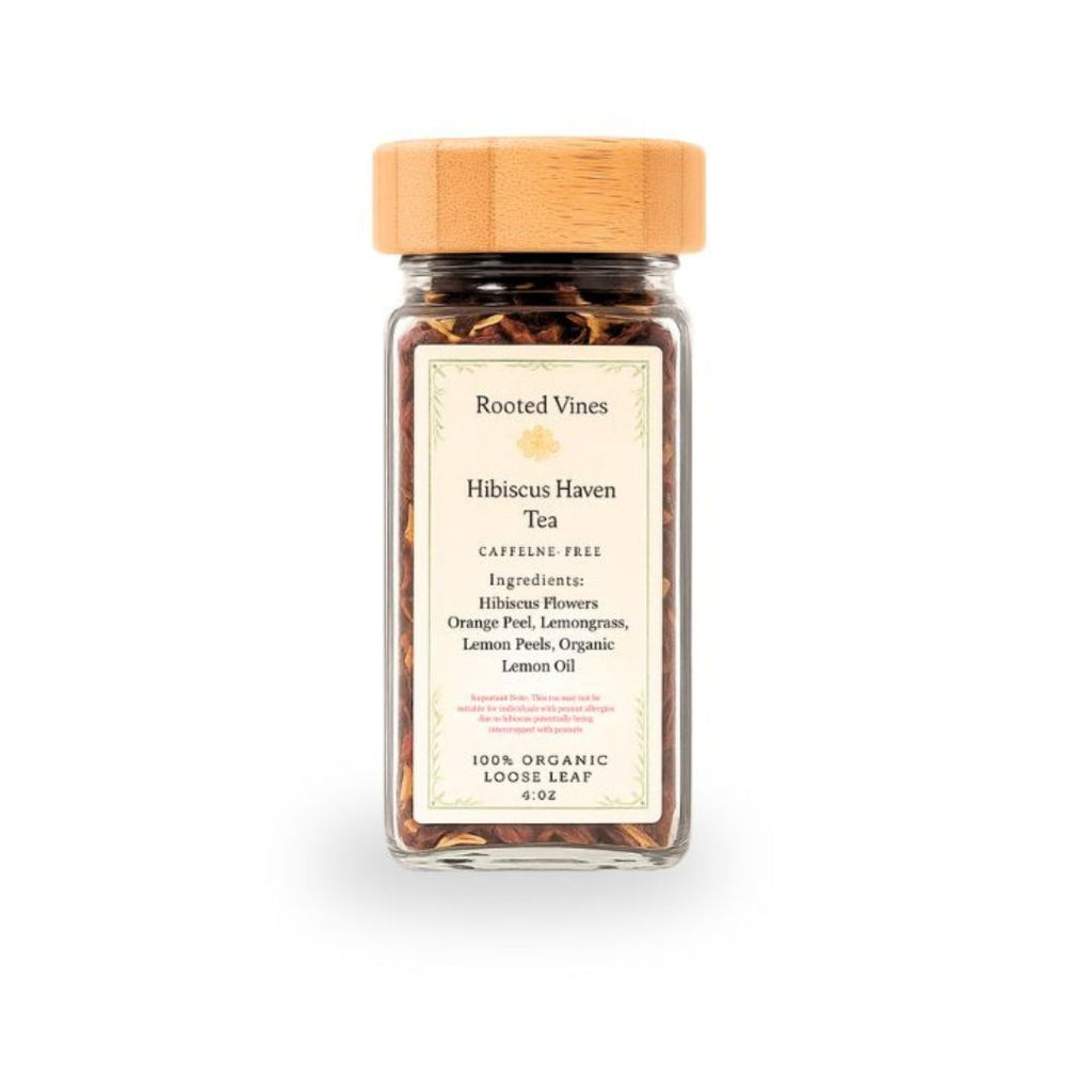 Jar of Rooted Vines Hibiscus Haven Tea with a wooden lid on a white background