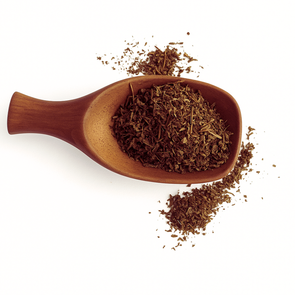 Wooden scoop filled with dried herbs on a white background
