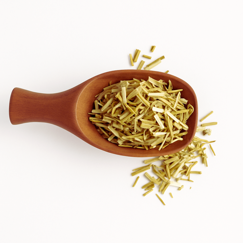 Wooden spoon filled with dried herbs on a white background