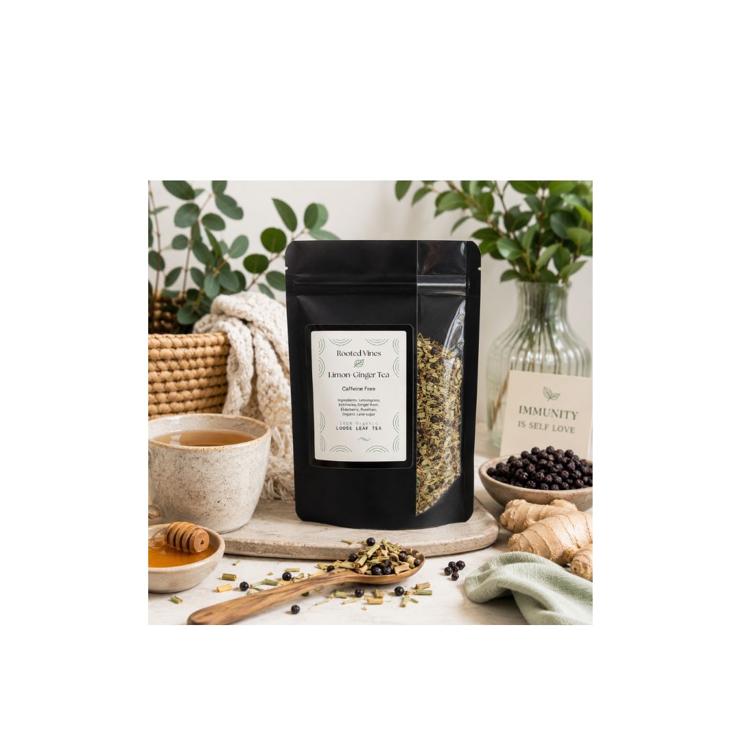 A black stand-up pouch of herbal tea labeled 'Immunity Lemon Ginger Tea' is centered on a light surface, surrounded by tea ingredients and props including loose leaves, a cup, honey, ginger root, and a glass bottle. No person or animal is present, but this is a styled product scene rather than a plain studio cutout, so Product/Packaging fits better than Lifestyle.