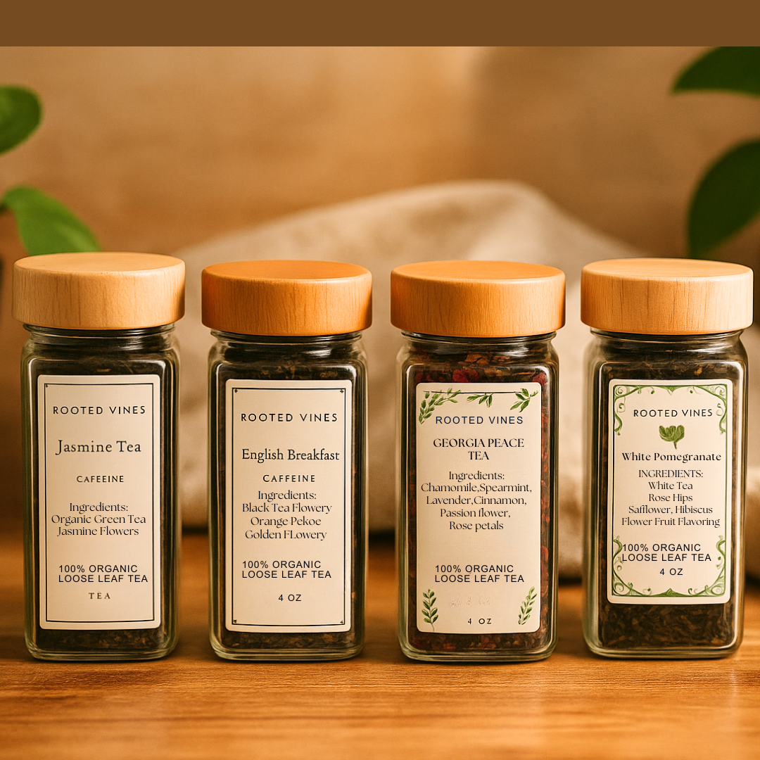 Four jars of Rooted Vines tea with wooden lids on a wooden surface.