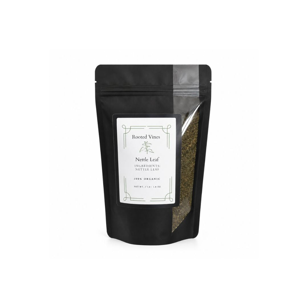 A black stand-up pouch of Rooted Vines Nettle Leaf with a white label and a clear window showing the dried green-brown nettle leaves inside, set against a plain white background.