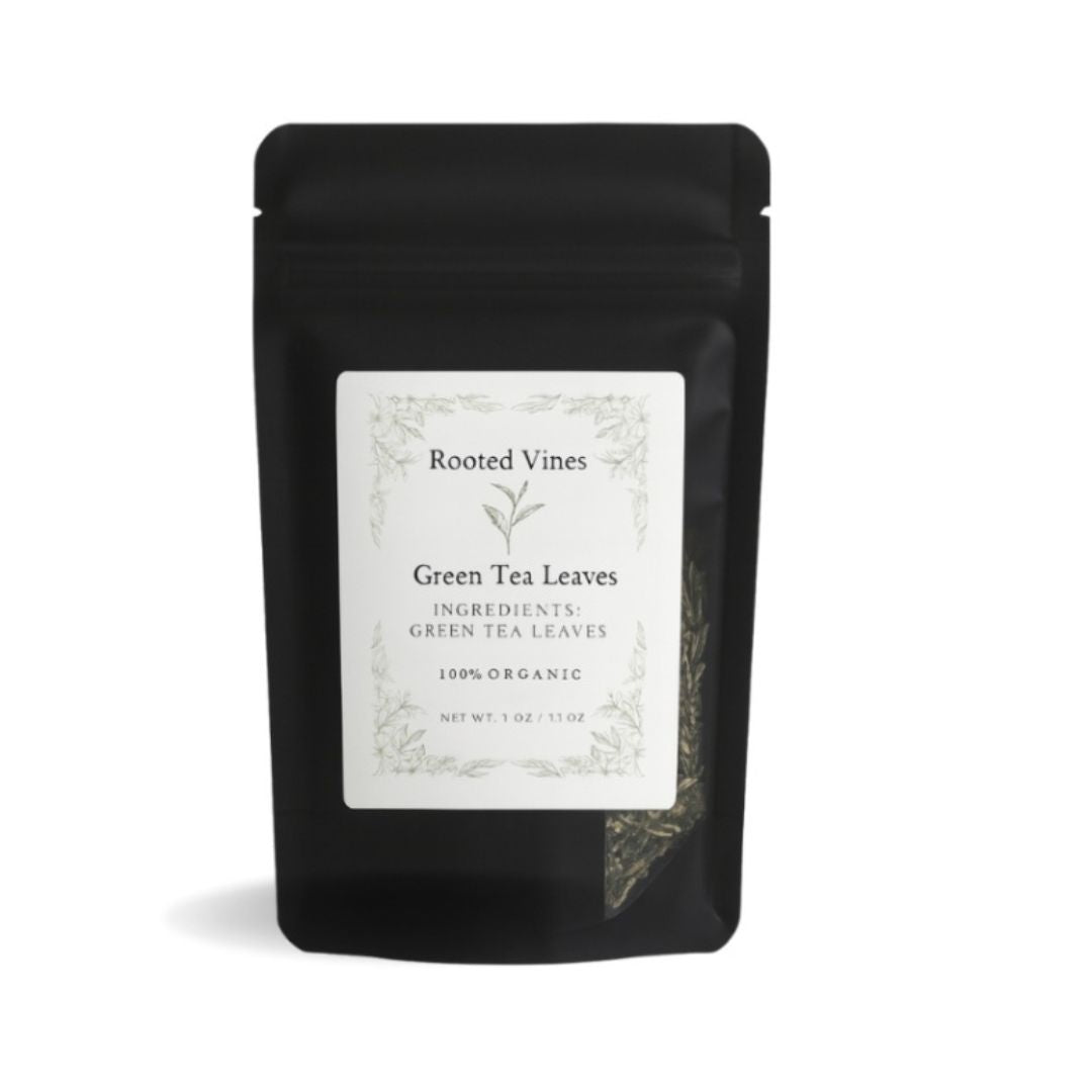 Black package of green tea leaves with a label on a white background