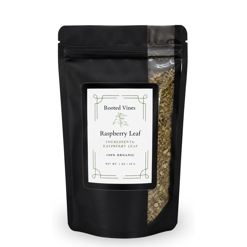 A black stand-up pouch of Rooted Vines Raspberry Leaf ingredients, featuring a clear window on the right side that shows the dried green leaf pieces inside, set against a plain white background.