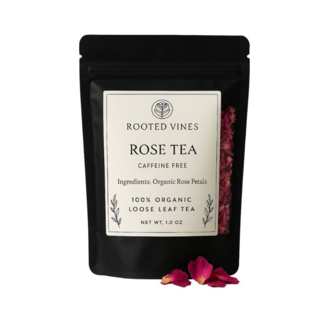 Black tea bag packaging for 'Rose Tea' by Rooted Vines on a white background