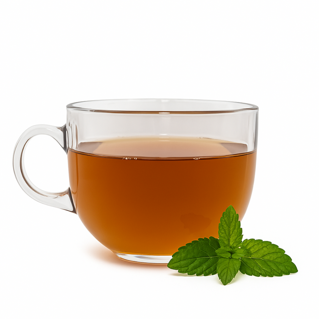 Clear glass mug filled with tea and a sprig of mint on a white background