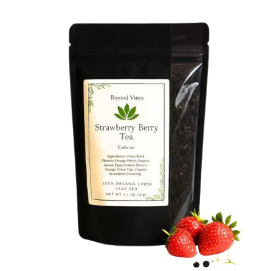 Black tea package labeled 'Strawberry Berry Tea' with strawberries on a white background