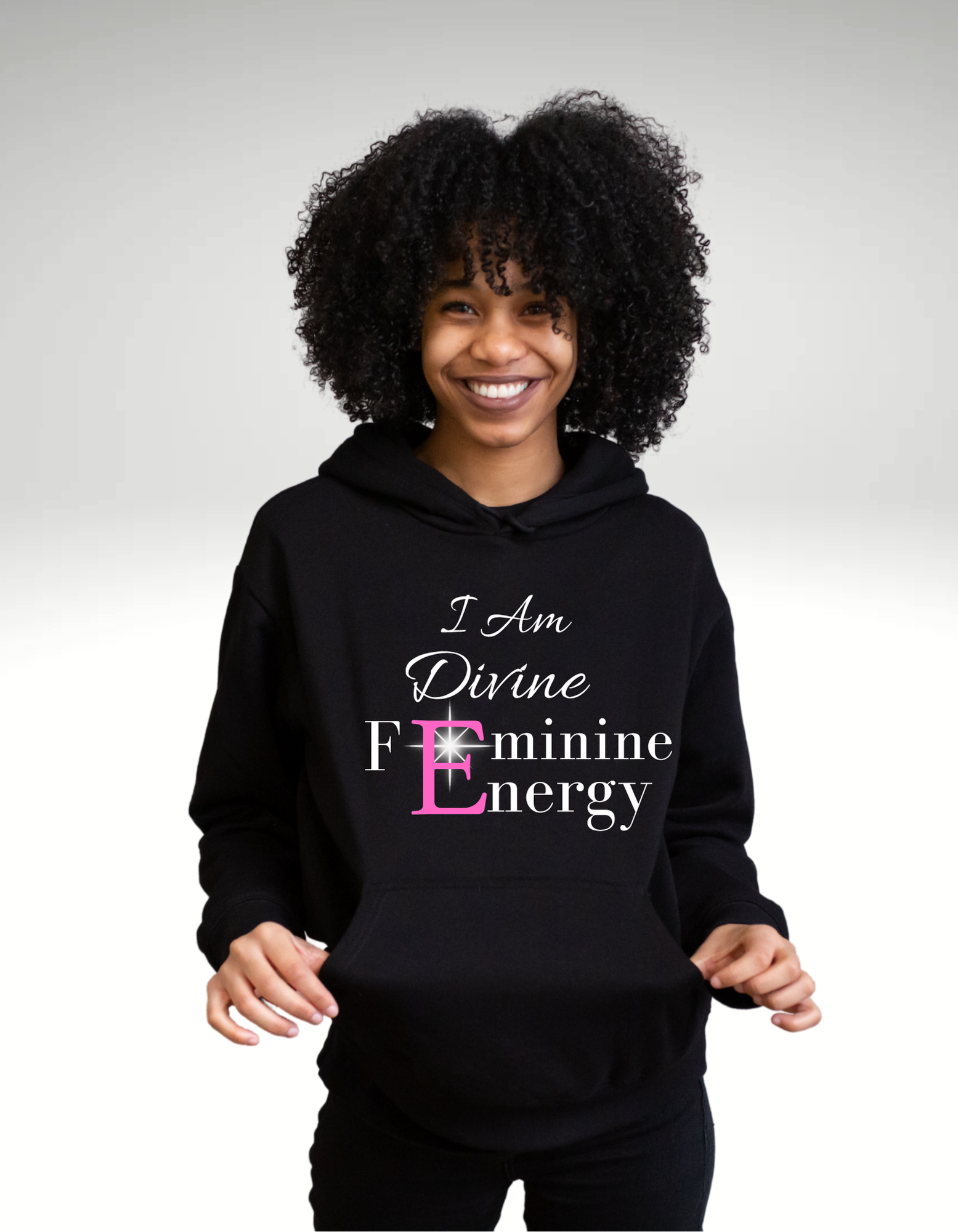 Person wearing a black hoodie with text on a white background