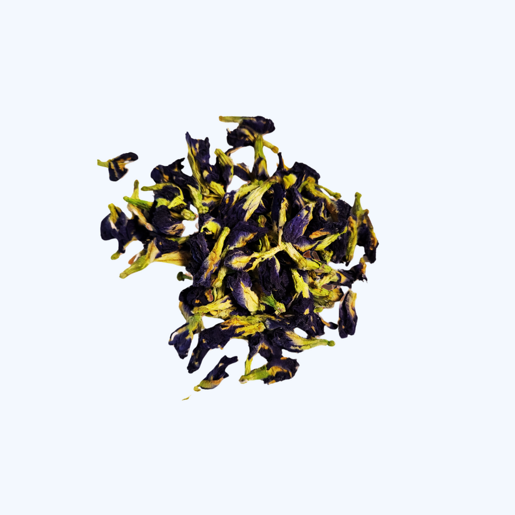 Cluster of black and yellow butterfly pea flowers on a white background