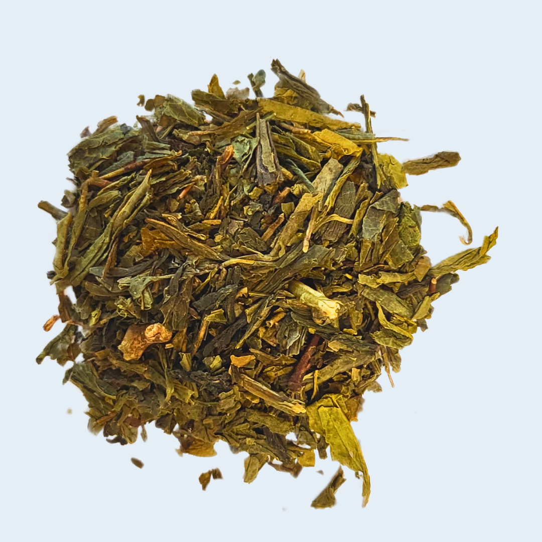 Heap of green tea leaves on a light blue background