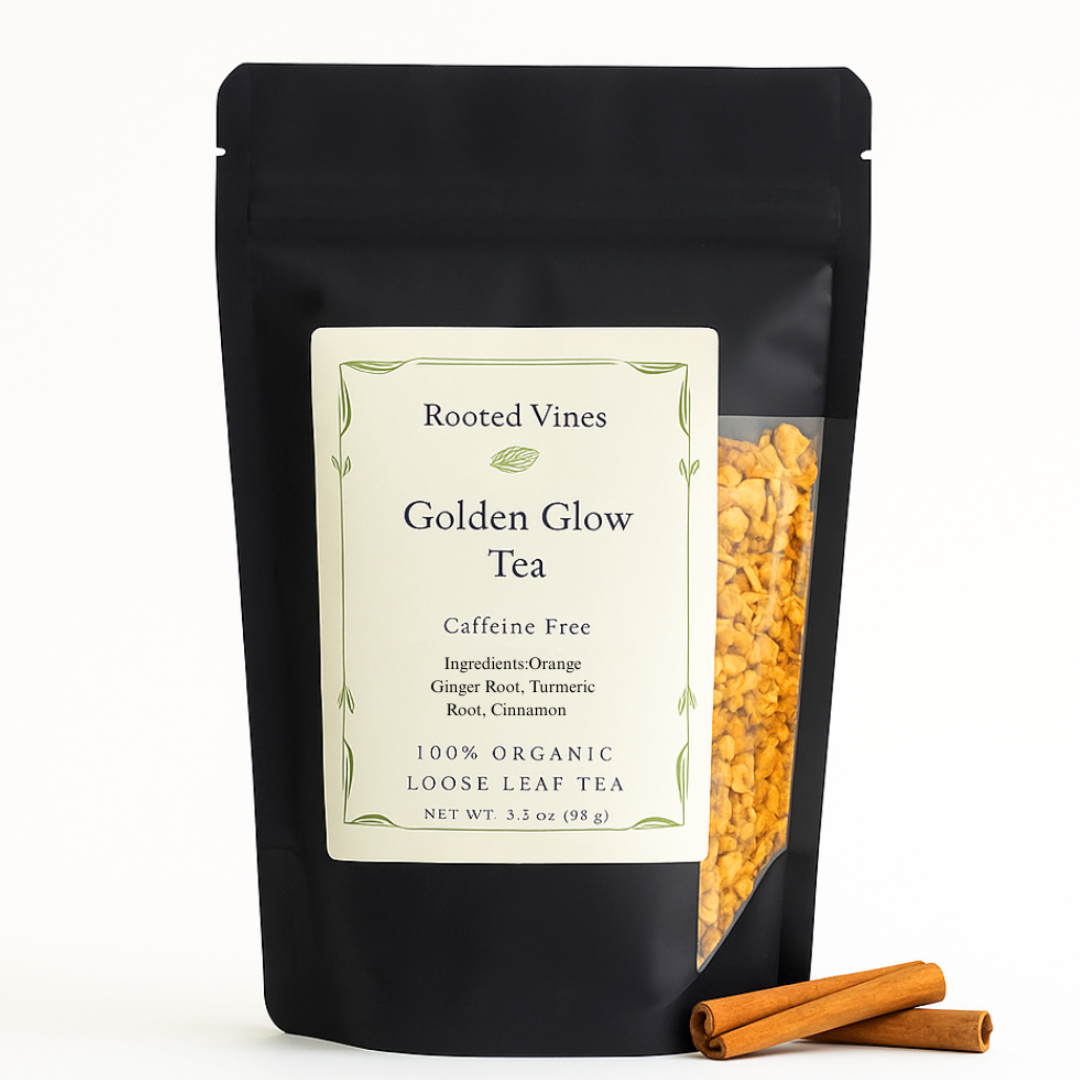 Black pouch of 'Golden Glow Tea' from Rooted Vines with visible tea leaves and cinnamon sticks on a white background.
