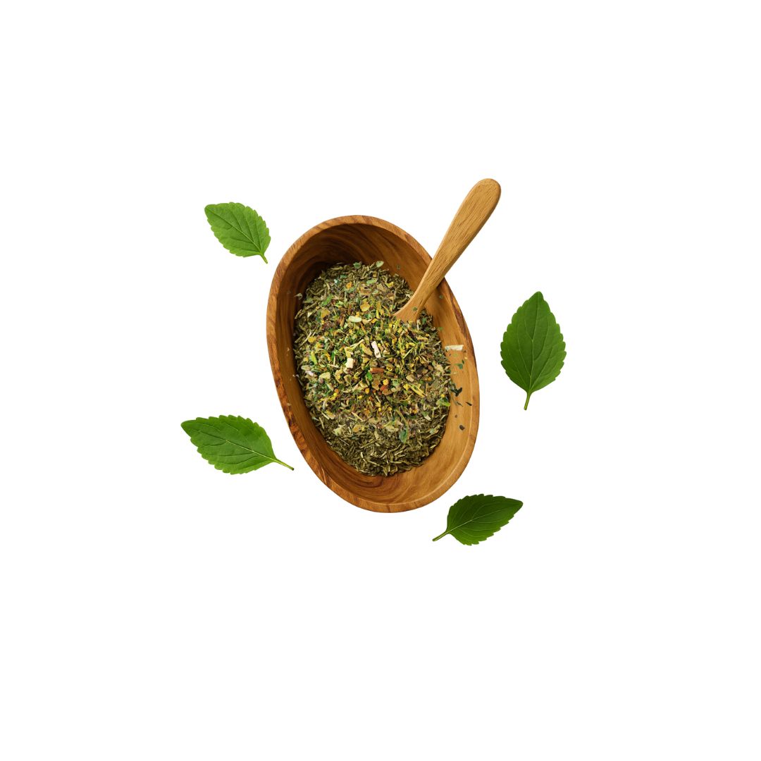 Wooden bowl with dried herbs and a wooden spoon on a white background